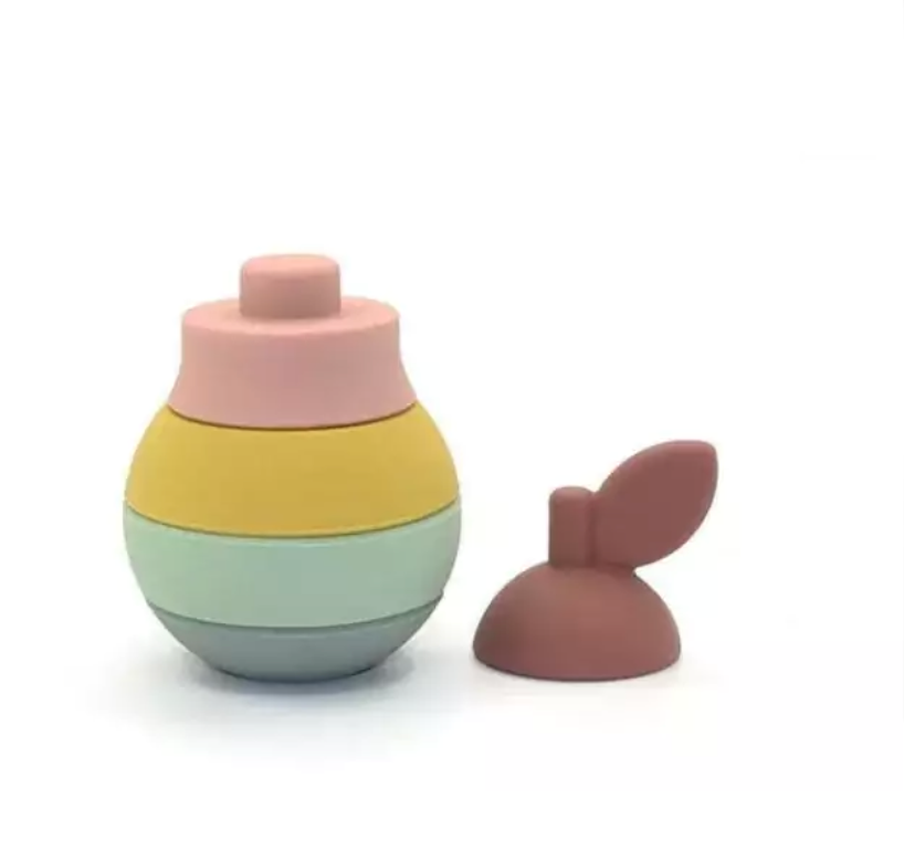 Blocos de encaixe em formato de pera em silicone colorido.