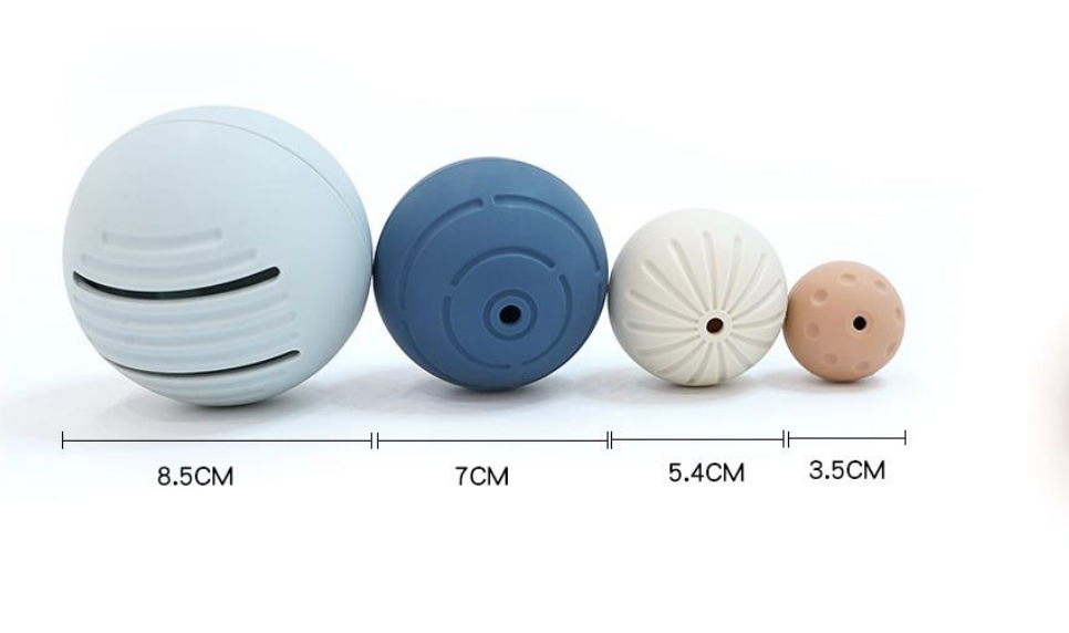 Bolas de Silicone colorido uma do lado da outra. Em baixo, sob cada bola esta escrito o tamanho de cada bola em centrimetros.