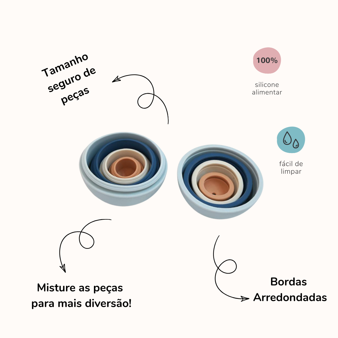 Bolas de silicone de cores variadas abertas ao meio, encaixadas, uma dentro da outra. A imagem contem textos com informações sobre o produto.